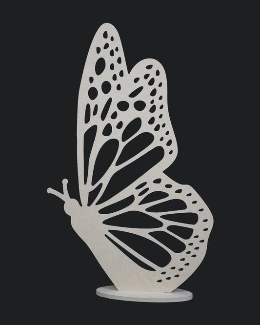 A decorative butterfly-shaped LED light with a single wing design, illuminated in a dark setting.