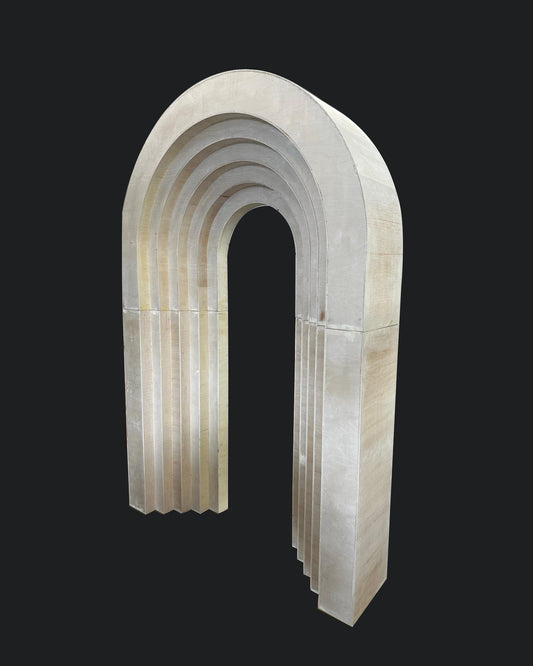 A 3D layered arch backdrop made from MDF, primarily white in color with multiple depth layers.