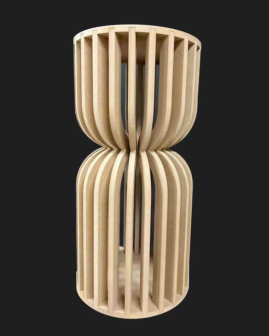 A beige-colored parametric spiral plinth made from MDF, designed for displaying cakes and desserts.