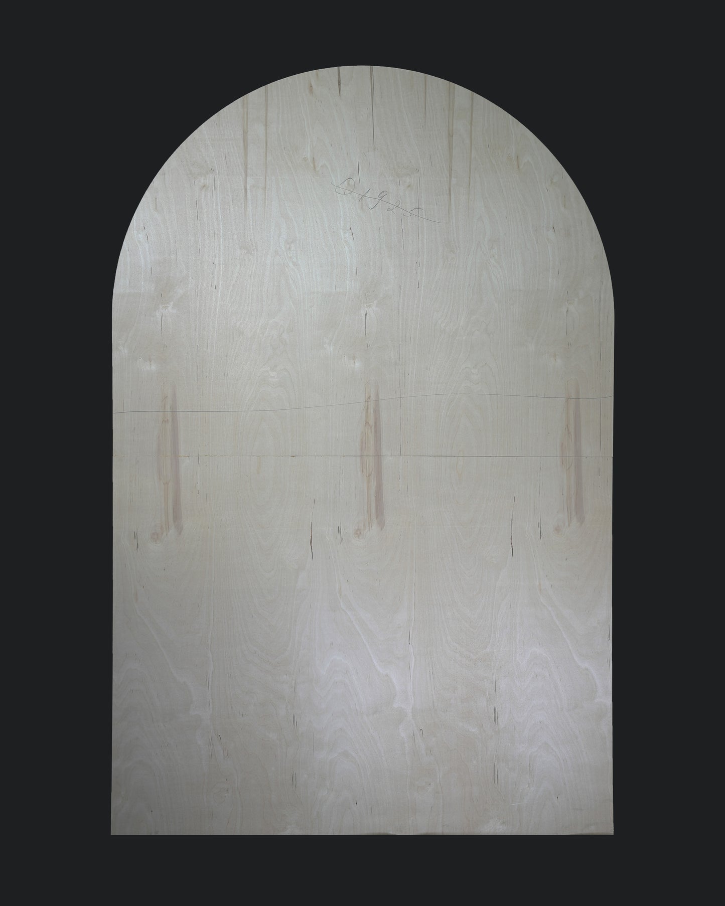 An oval-shaped plain backdrop with a light color, possibly white or beige, intended for use in photography or stage settings.